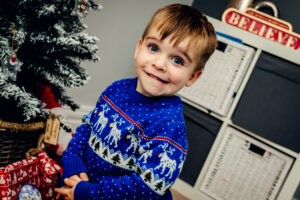 Image of a boy excited for Christmas taken by Sophie Ransome Lifestyle Photograper
