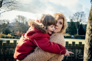 Mum and son cuddle at the park taken by Sophie Ransome Lifestyle Photographer