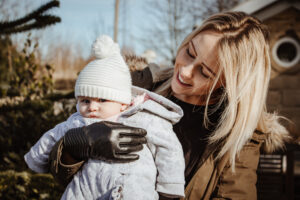 Mum and bay wrapped up outside during family session with Sophie Ransome Lifestyle Photographer