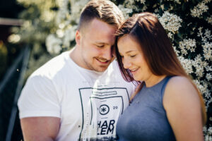 Parents to be smile together during maternity shoot with Sophie Ransome Lifestyle Photographer