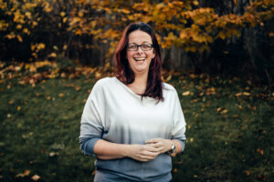 A portrait of a happy woman by Sophie Ransome Lifestyle Photographer